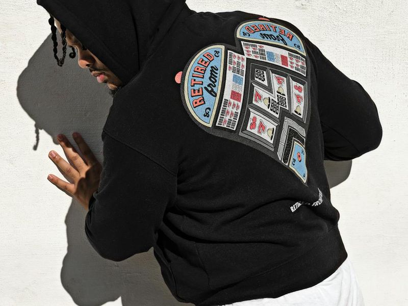 Person hands doing rhythmic movements against dark wall